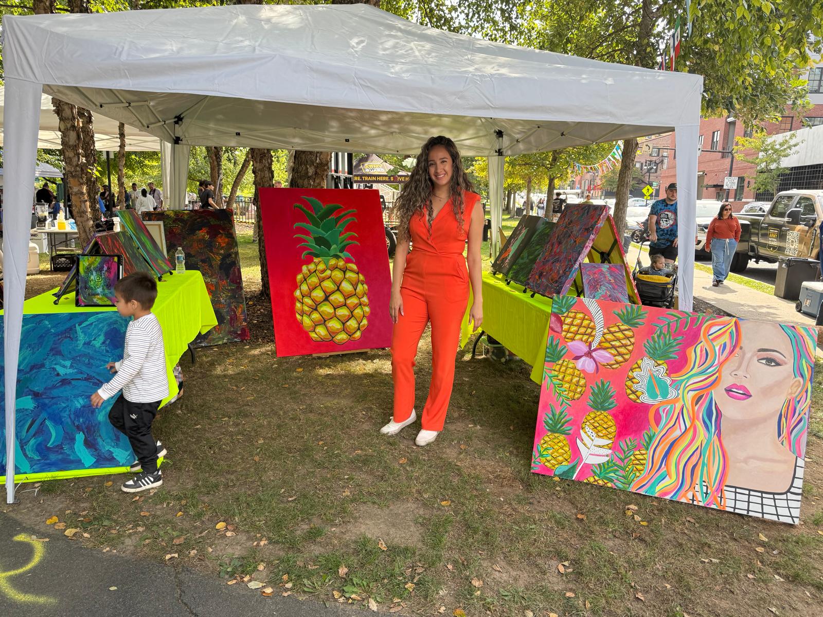 Local artist displaying colorful paintings