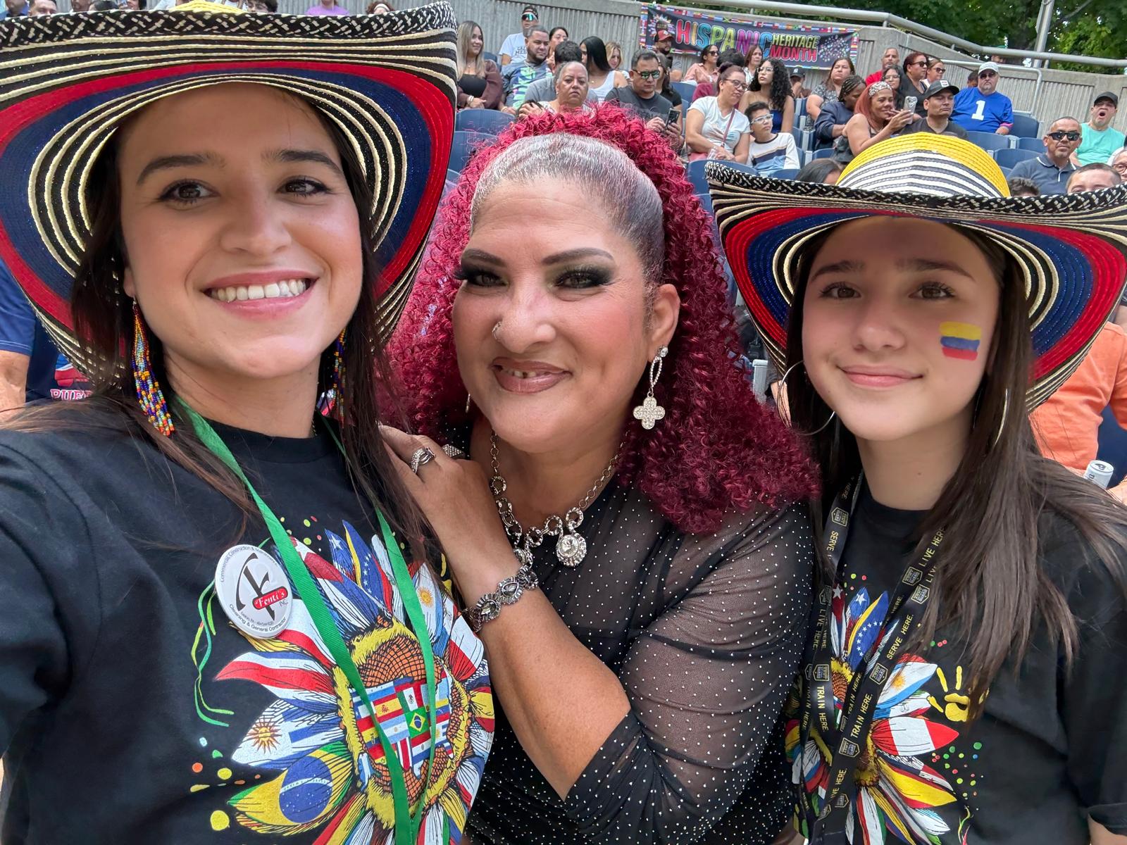 Festival guests and a performer smiling together