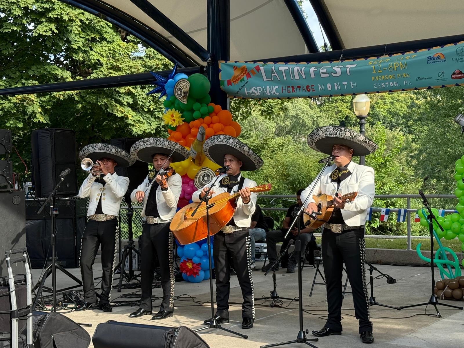 Mariachi musicians performing live on the festival stage