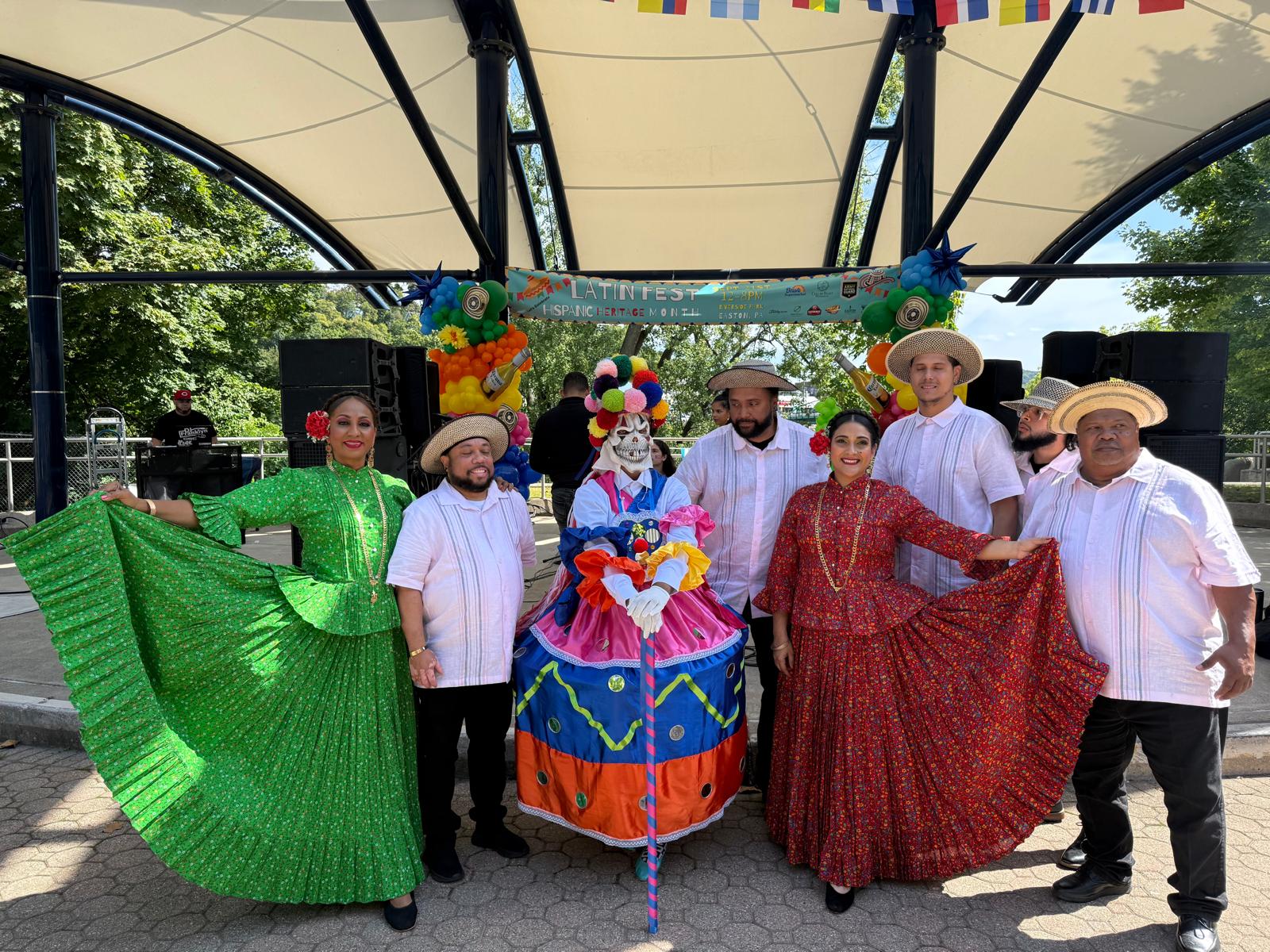 Traditional dance ensemble in colorful clothing on stage